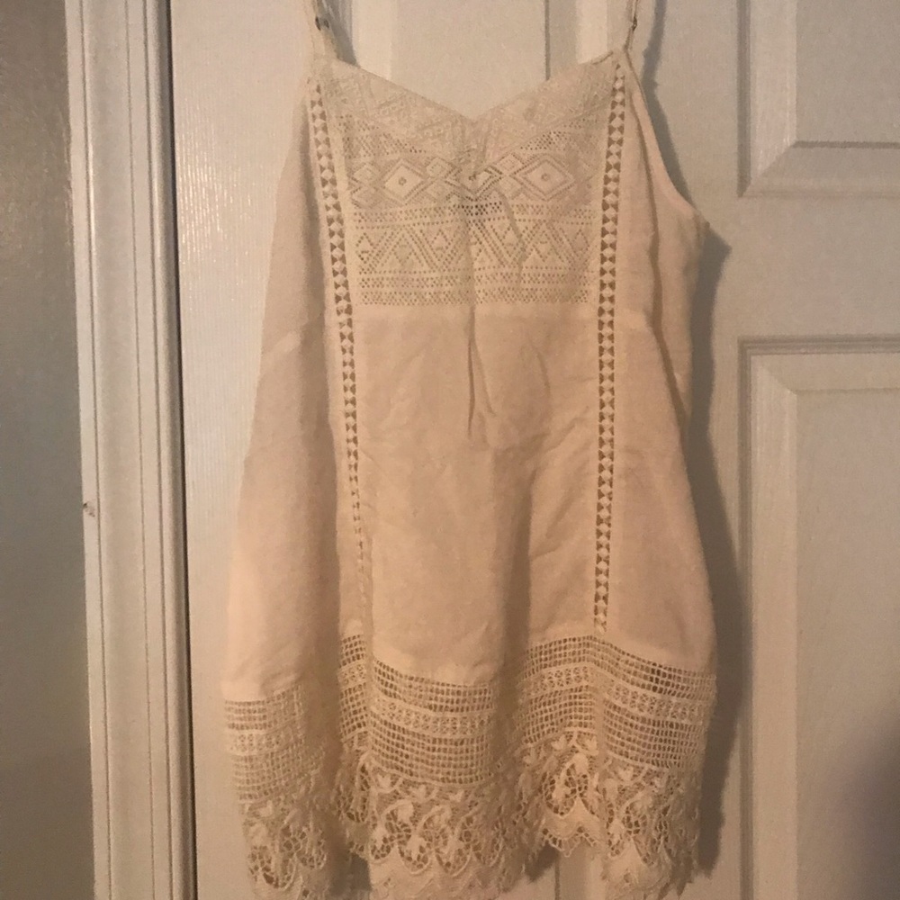 Embroidered flowy tank/camisole.